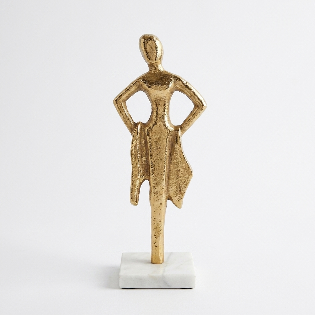 Golden woman sculpture for home decor on display shelf