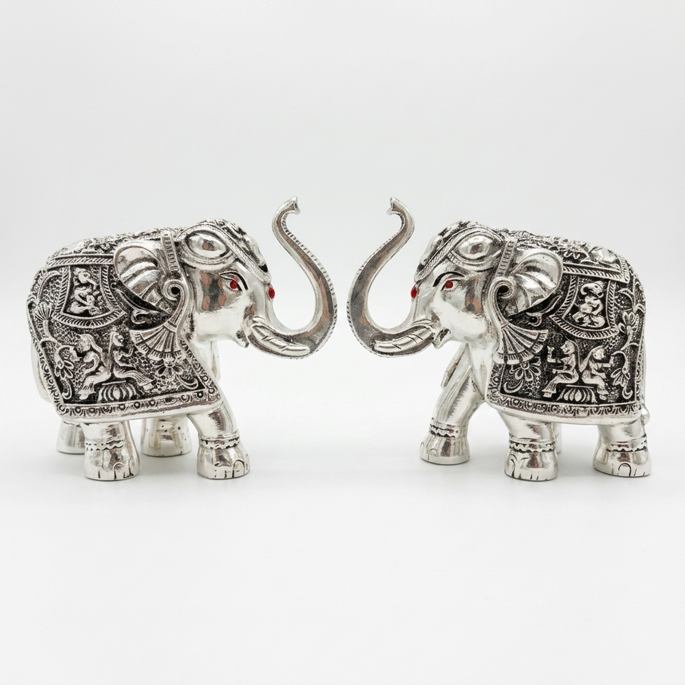 Silver elephant pair showpiece with ornate detailing for home décor