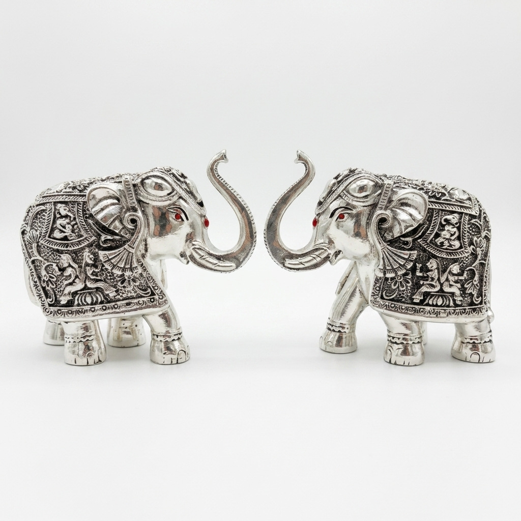 Silver elephant pair showpiece with ornate detailing for home décor