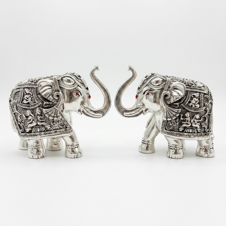 Silver elephant pair showpiece with ornate detailing for home décor