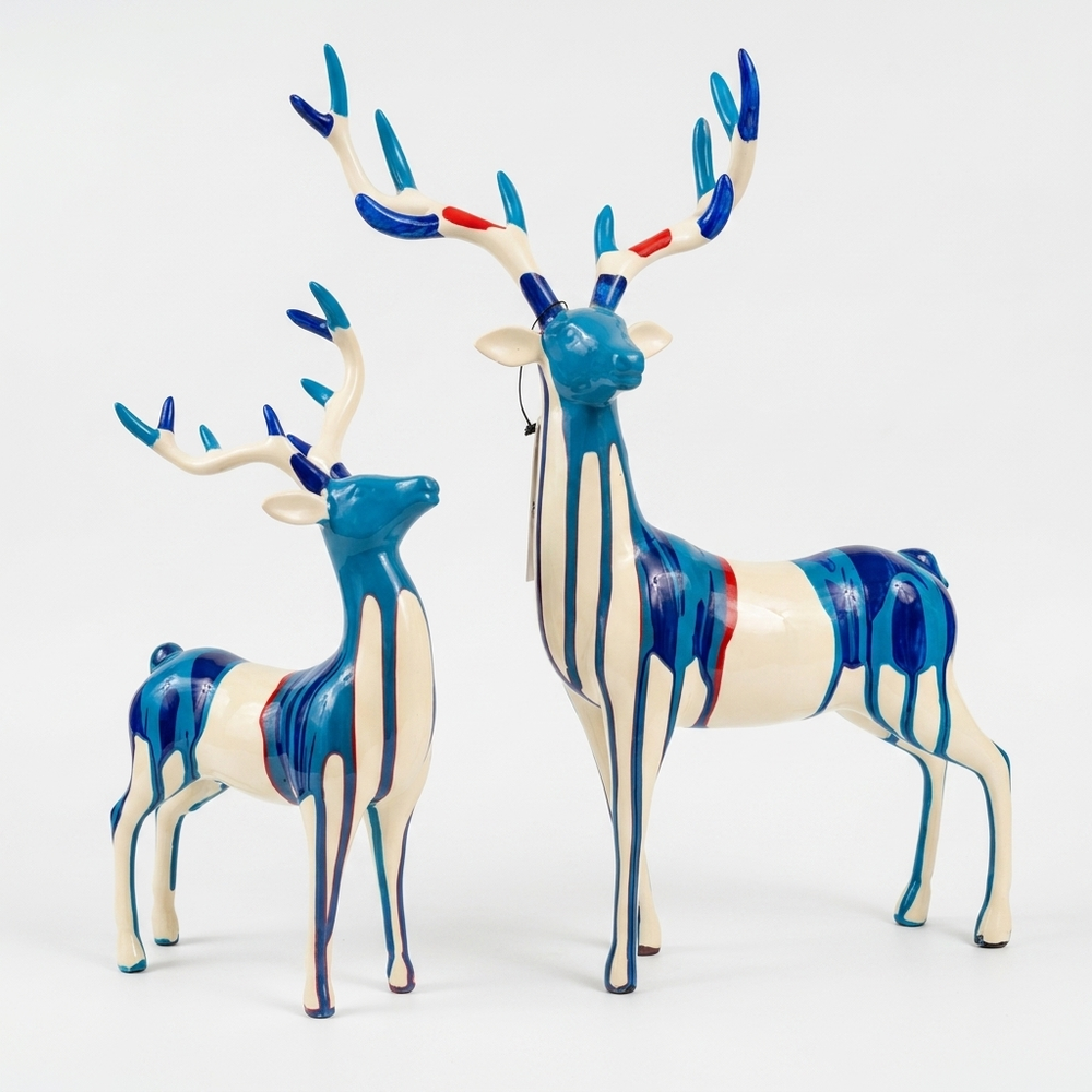 Blue deer showpiece pair with artistic drip design for home decor