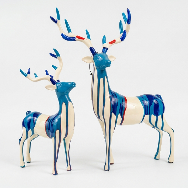 Blue deer showpiece pair with artistic drip design for home decor