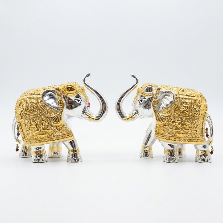 Royal elephant figurine pair with ornate gold detailing