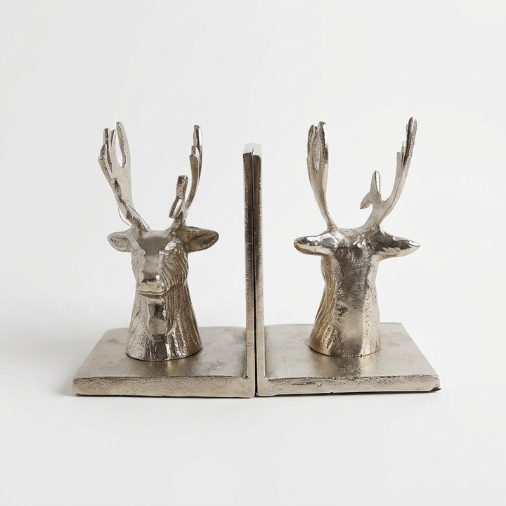 Decorative deer bookends set in antique silver finish on bookshelf